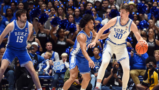 Oct 20, 2023; Durham, NC, USA; Duke Blue Devils center Kyle Filipowski(30) controls the ball in front of Duke Blue Devils guard Jared McCain (0) during Countdown to Craziness at Cameron Indoor Stadium. Mandatory Credit: Rob Kinnan-USA TODAY Sports