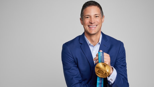 Steve Mesler poses with the gold medal he won at the 2010 Winter Olympics in Vancouver for four-man bobsled.