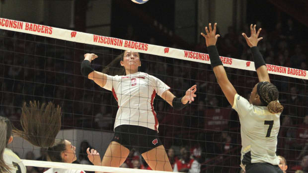 Wisconsin Caroline Crawford prepares to make a kill as Purdue's Raven Colvin defends on Wednesday Nov. 1, 2023 at the UW Field House in Madison, Wisconsin.