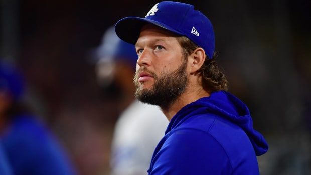 Dodgers starting pitcher Clayton Kershaw looks up while in the dugout during a game.