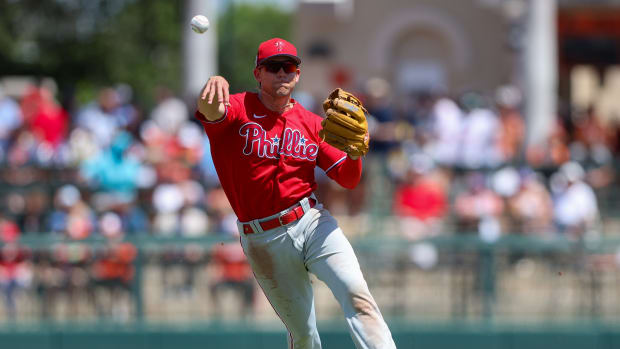 Mar 26, 2023; Sarasota, Florida, USA; Philadelphia Phillies shortstop Scott Kingery (4) throws to first against the Baltimore Orioles in the fourth inning during spring training at Ed Smith Stadium. Mandatory Credit: Nathan Ray Seebeck-USA TODAY Sports