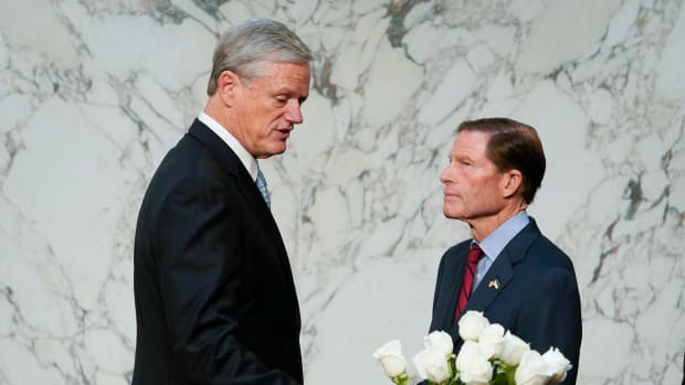 Oct 17, 2023; Washington, DC, USA; Senator Richard Blumenthal (D-CT), right, speaking with NCAA President Charlie Baker, left, before the start of the Senate Judiciary Committee hearing \"Name, Image, and Likeness, and the Future of College Sports\" on Tuesday, Oct. 17, 2023 standing in front of a bouquet of flowers in memory of Senator Dianne Feinstein who passed away on September 29, 2023. Mandatory Credit: Jack Gruber-USA TODAY