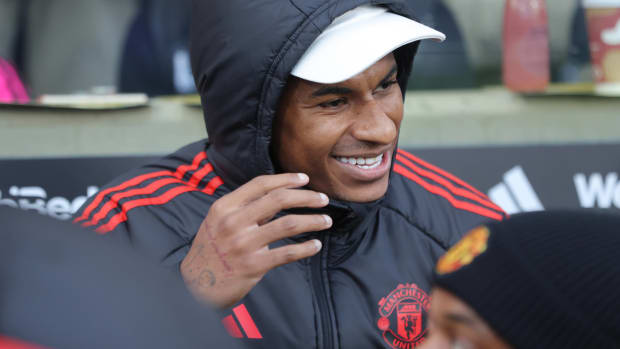Manchester United striker Marcus Rashford pictured on the bench during his team's Premier League game at Fulham in November 2023