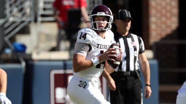 Nov 4, 2023; Oxford, Mississippi, USA; Texas A&M Aggies quarterback Max Johnson (14) passes the ball against the Mississippi Rebels during the first half at Vaught-Hemingway Stadium.