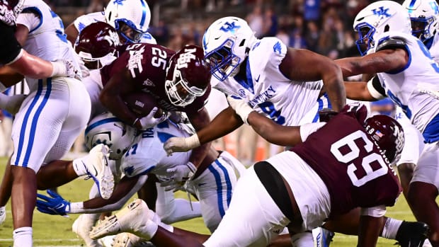 Mississippi State Bulldogs running back Jeffery Pittman (25) is stopped short of the endzone by Kentucky Wildcats linebacker Daveren Rayner (17) during the fourth at Davis Wade Stadium at Scott Field.