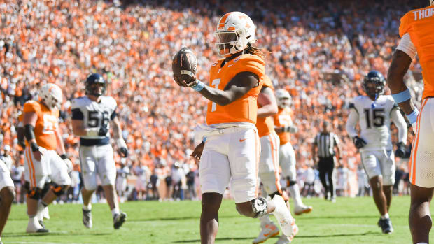Tennessee quarterback Joe Milton III (7) runs into the end zone for a touchdown during a NCAA college football game between Tennessee and Connecticut at Neyland Stadium in Knoxville, Tenn., on Saturday, Nov. 4, 2023.