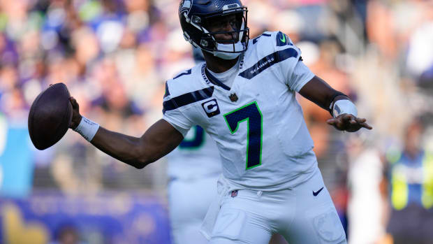 Seattle Seahawks quarterback Geno Smith (7) passes against the Baltimore Ravens during the third quarter at M&T Bank Stadium.