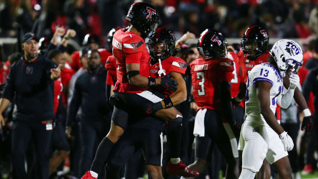 Nov 2, 2023; Lubbock, Texas, USA; Texas Tech Red Raiders defensive safety Darion Taylor-Demerson (1) reacts with defensive back CJ Baskerville (9) after making an interception to end the game as Texas Christian Horned Frogs wide receiver Jaylon Robinson (13) leave the field at Jones AT&T Stadium and Cody Campbell Field. Mandatory Credit: Michael C. Johnson-USA TODAY Sports  