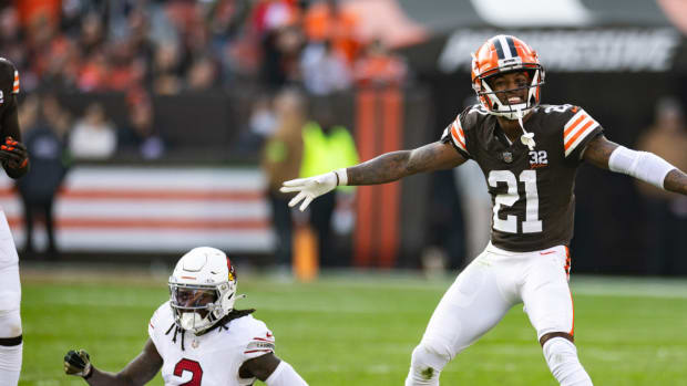 Cleveland Browns cornerback Denzel Ward (21) celebrates his broken up pass intended for Arizona Cardinals wide receiver Marquise Brown (2) during the third quarter at Cleveland Browns Stadium.