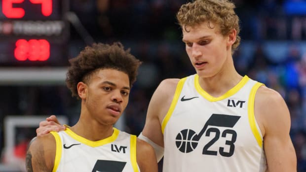 Utah Jazz forward Lauri Markkanen (23) and guard Keyonte George (3) talk during a break against the Minnesota Timberwolves in the fourth quarter at Target Center.