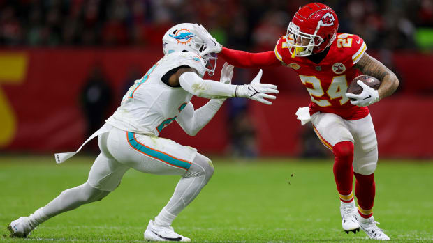 Nov 5, 2023; Frankfurt, Germany, ; Kansas City Chiefs wide receiver Skyy Moore (24) holds off Miami Dolphins safety DeShon Elliott (21) in the second quarter during an NFL International Series game at Deutsche Bank Park. Mandatory Credit: Nathan Ray Seebeck-USA TODAY Sports  