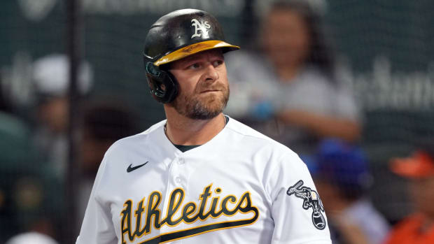 Former Athletics catcher Stephen Vogt goes to the plate.