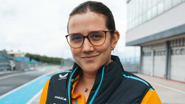 McLaren Racing engineer Amelia Lewis poses outside the F1 team’s garage.