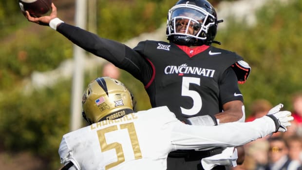 UC's quarterback Emory Jones (5) launches the ball during the UC vs. UCF game at Nippert Stadium on Saturday November 4, 2023. UCF leads the game at halftime with a score of 14-10.