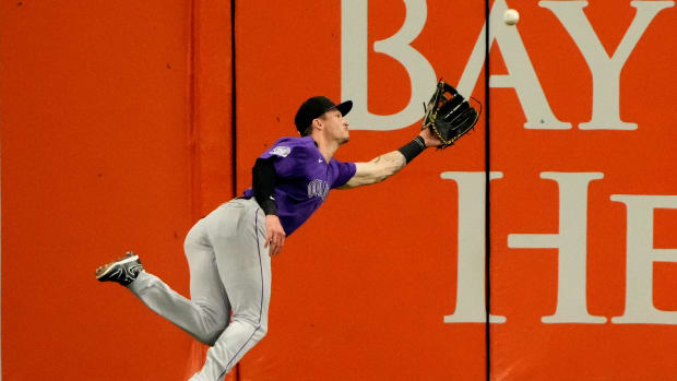 Aug 23, 2023; St. Petersburg, Florida, USA; Colorado Rockies center fielder Brenton Doyle (9) catches a ball hit by Tampa Bay Rays right fielder Josh Lowe (15) during the fifth inning at Tropicana Field.