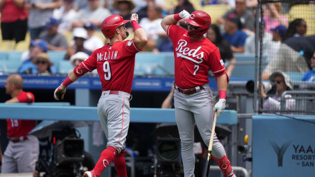 Jul 30, 2023; Los Angeles, California, USA; Cincinnati Reds shortstop Matt McLain (9) celebrates with first baseman Spencer Steer (7) after hitting a home run in the third inning against the Los Angeles Dodgers at Dodger Stadium.