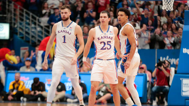 Kansas senior center Hunter Dickinson (1), graduate senior guard Nicolas Timberlake (25) and graduate senior guard Kevin McCullar Jr. (15) head down court during the first half of Wednesday's exhibition game against Fort Hays State inside Allen Fieldhouse.  