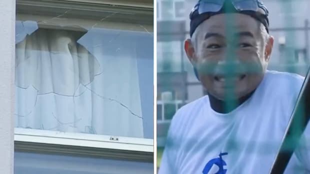 Ichiro Suzuki grimaces after breaking a window with a home run