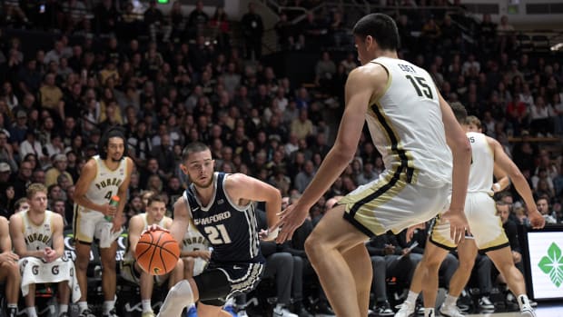 Samford Bulldogs guard Rylan Jones drives the ball toward the basket against Purdue Boilermakers center Zach Edey during the first half at Mackey Arena.