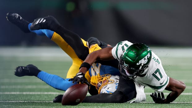 Jets' WR Garrett Wilson (17) loses a fumble vs. the Chargers