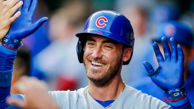 Sep 1, 2023; Cincinnati, Ohio, USA; Chicago Cubs first baseman Cody Bellinger (24) high fives teammates after hitting a solo home run in the third inning against the Cincinnati Reds at Great American Ball Park. Mandatory Credit: Katie Stratman-USA TODAY Sports