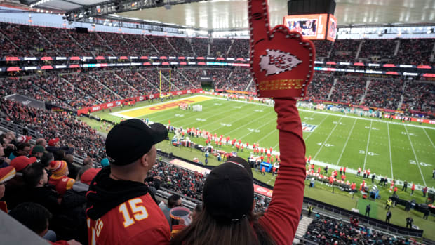 Chiefs fans cheer as they watch their team play the Dolphins during the first half of an NFL game in Frankfurt, Germany.