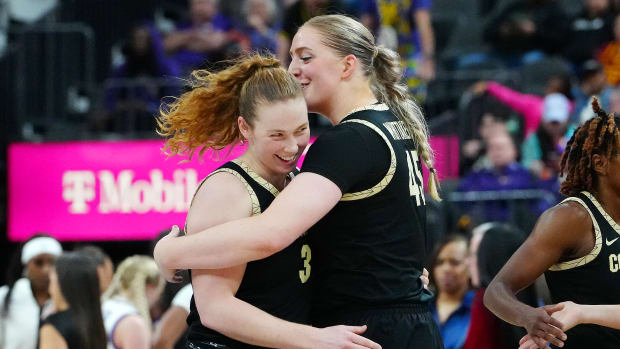 Colorado Buffaloes guard Frida Formann (3) celebrates with Colorado Buffaloes forward Charlotte Whittaker (45) after the LSU Lady Tigers called a time out during the fourth quarter at T-Mobile Aren