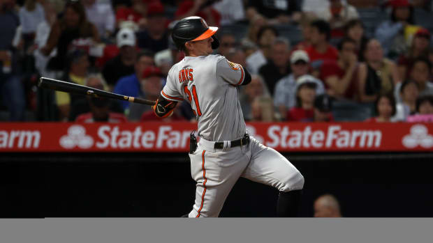 Sep 6, 2023; Anaheim, California, USA; Baltimore Orioles left fielder Austin Hays (21) hits an RBI single during the third inning against the Los Angeles Angels at Angel Stadium. Mandatory Credit: Kiyoshi Mio-USA TODAY Sports