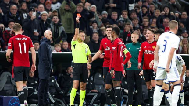 Erik ten Hag (second from left) pictured watching on as Marcus Rashford (10) is shown a red card during Manchester United's 4-3 defeat at FC Copenhagen in November 2023
