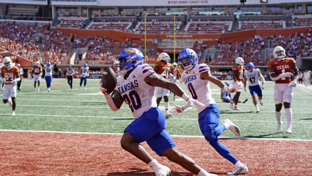 Sep 30, 2023; Austin, Texas, USA; Kansas Jayhawks running back Daniel Hishaw Jr. (20) and wide receiver Quentin Skinner (0) celebrate after Hishaw Jr. scored a touchdown during the first half against the Texas Longhorns at Darrell K Royal-Texas Memorial Stadium. Mandatory Credit: Scott Wachter-USA TODAY Sports  