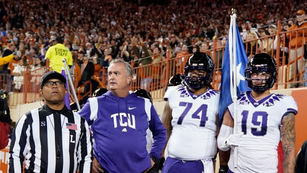 Texas Christian Horned Frogs head coach Sonny Dykes and players wait to take the field before the game against the Texas Longhorns at Darrell K Royal-Texas Memorial Stadium.