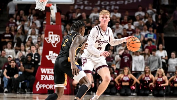 Nov 6, 2023; College Station, Texas, USA; Texas A&M Aggies guard Hayden Hefner (2) dribbles the ball as Texas A&M Commerce guard Kalen Williams (2) defends in the second half at Reed Arena.
