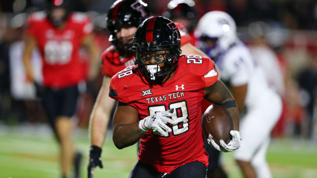 Nov 2, 2023; Lubbock, Texas, USA; Texas Tech Red Raiders running back Tahj Brooks (28) rushes in the second half against the Texas Christian Horned Frogs at Jones AT&T Stadium and Cody Campbell Field. 