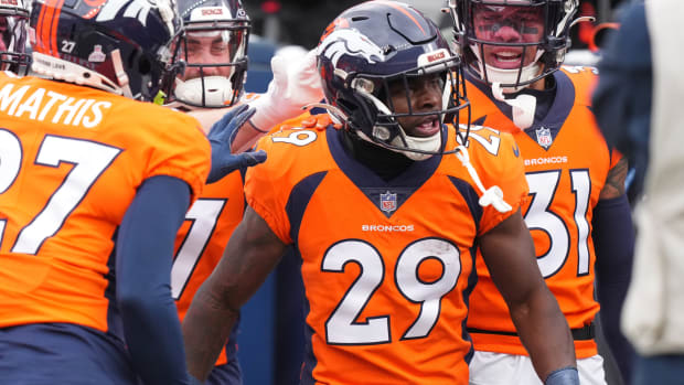 Denver Broncos cornerback Ja'Quan McMillian (29) celebrates his interception in the second quarter against the Kansas City Chiefs at Empower Field at Mile High.