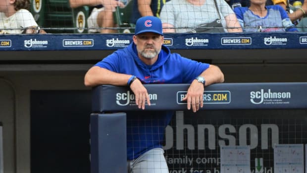 Oct 1, 2023; Milwaukee, Wisconsin, USA; Chicago Cubs manager David Ross looks on from the dugout in the eighth inning during game against the Milwaukee Brewers at American Family Field. Mandatory Credit: Benny Sieu-USA TODAY Sports