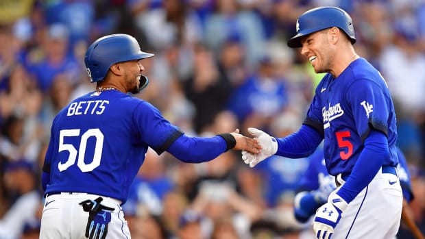 Jul 6, 2023; Los Angeles, California, USA; Los Angeles Dodgers first baseman Freddie Freeman (5) is greeted by second baseman Mookie Betts (50) after hitting a two run home run against the Pittsburgh Pirates during the first inning at Dodger Stadium.