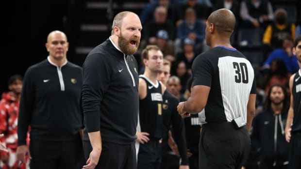 Nov 10, 2023; Memphis, Tennessee, USA; Memphis Grizzlies head coach Taylor Jenkins (left) reacts to a referee after forward-center Jaren Jackson Jr. (not pictured) was called for two technical fouls during the second half against the Utah Jazz at FedExForum.