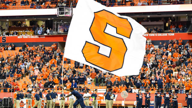Oct 18, 2019; Syracuse, NY, USA; A cheerleader runs with a Syracuse Orange flag prior to the game against the Pittsburgh Panthers at the Carrier Dome. Mandatory Credit: Rich Barnes-USA TODAY Sports