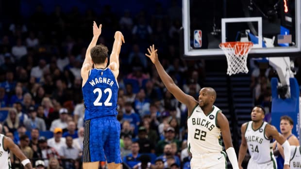 Orlando Magic forward Franz Wagner (22) shoots over Milwaukee Bucks forward Khris Middleton (22) during the second half at Amway Center.