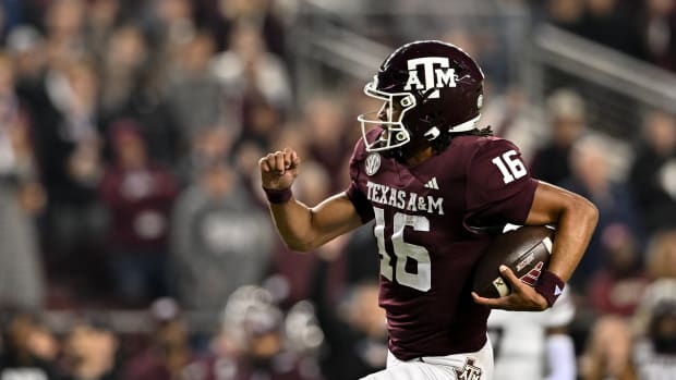 Nov 11, 2023; College Station, Texas, USA; Texas A&M Aggies quarterback Jaylen Henderson (16) runs the ball into the end zone for a touchdown during the first quarter against the Mississippi State Bulldogs at Kyle Field.