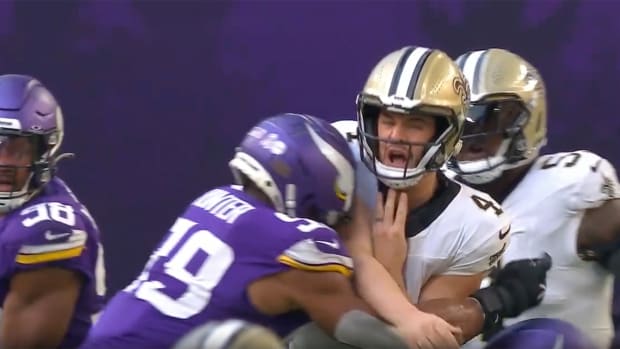 Saints quarterback Derek Carr getting hit by Vikings outside linebacker Danielle Hunter.