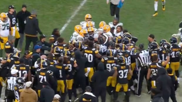 Packers and Steelers tussle at the end of the game.