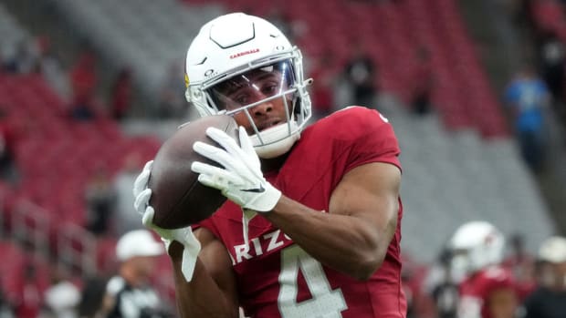 Arizona Cardinals receiver Rondale Moore (4) warms up before their game against the Atlanta Falcons at State Farm Stadium.