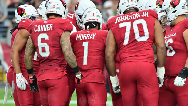 Arizona Cardinals quarterback Kyler Murray (1) huddles with the offense in the first half against the Atlanta Falcons at State Farm Stadium.