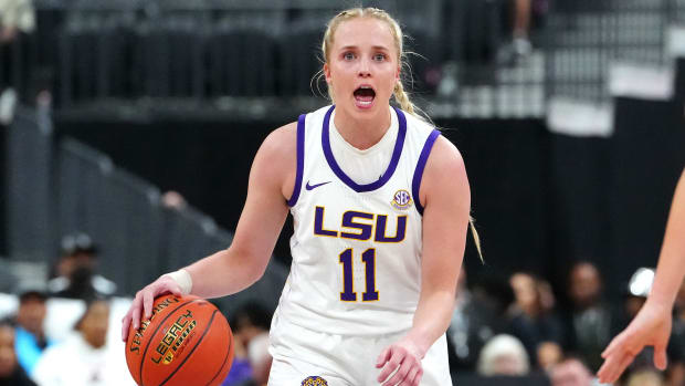 LSU guard Hailey Van Lith dribbles the ball while calling out instructions