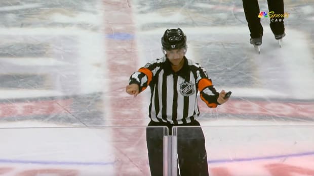 Ref points for Connor Bedard to go to the other penalty box