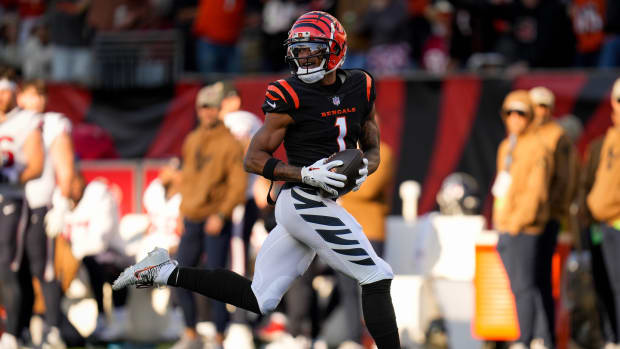 Cincinnati Bengals wide receiver Ja'Marr Chase (1) runs away with the ball on a touchdown reception in the third quarter of the NFL Week 10 game between the Cincinnati Bengals and the Houston Texans at Paycor Stadium in downtown Cincinnati on Sunday, Nov. 12, 2023.  