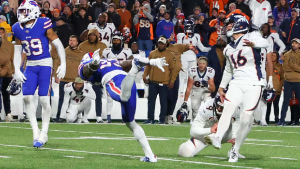 Denver Broncos place kicker Wil Lutz, right, looks after the winning field goal during the second half of an NFL football game against the Buffalo Bills, Monday, Nov. 13, 2023, in Orchard Park, N.Y. (AP Photo/Jeffrey T. Barnes)   