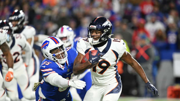 Denver Broncos wide receiver Marvin Mims Jr. (19) is tackled by Buffalo Bills tight end Quintin Morris (85) on a kickoff in the third quarter at Highmark Stadium.