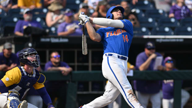 Jun 25, 2023; Omaha, NE, USA; Florida Gators first baseman Jac Caglianone (14) hits a home run against the LSU Tigers in the eighth inning at Charles Schwab Field Omaha.